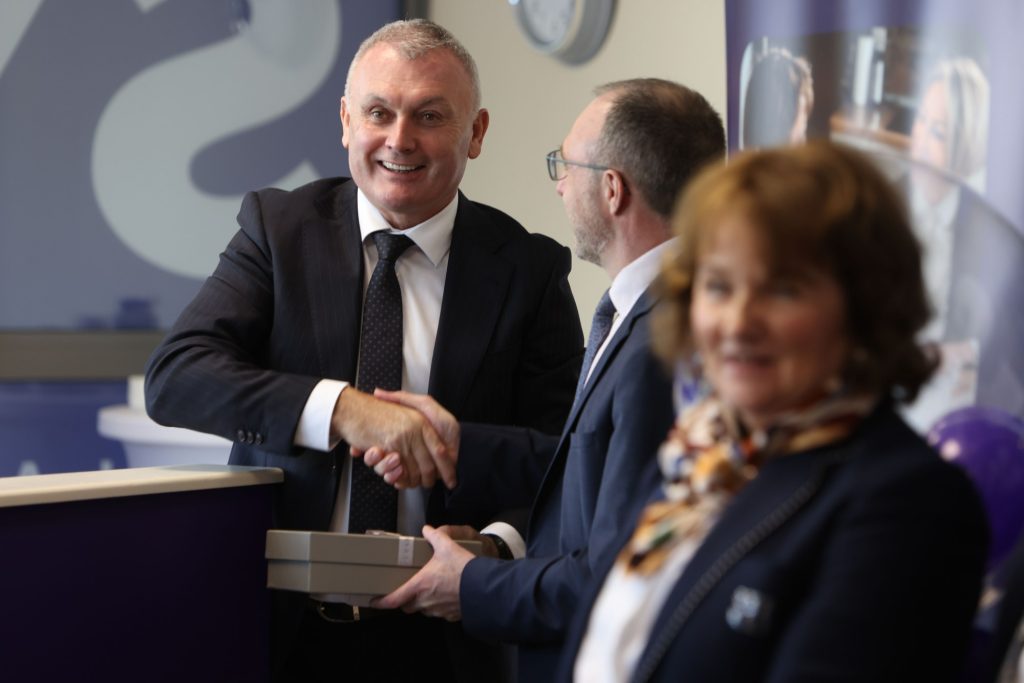 Guests greeting one another at the SYS Financial Claregalway office opening